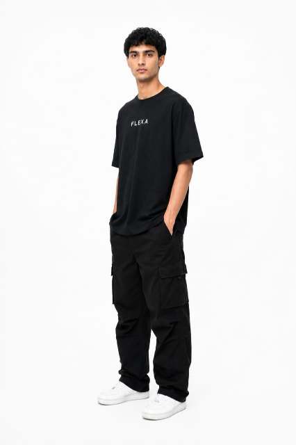 Person wearing a black t-shirt and pants with 'FLEXA' branding on a white background