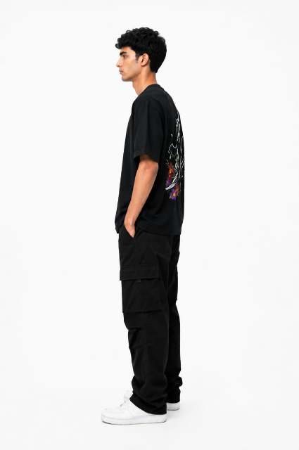 Person wearing a black t-shirt and pants on a white background