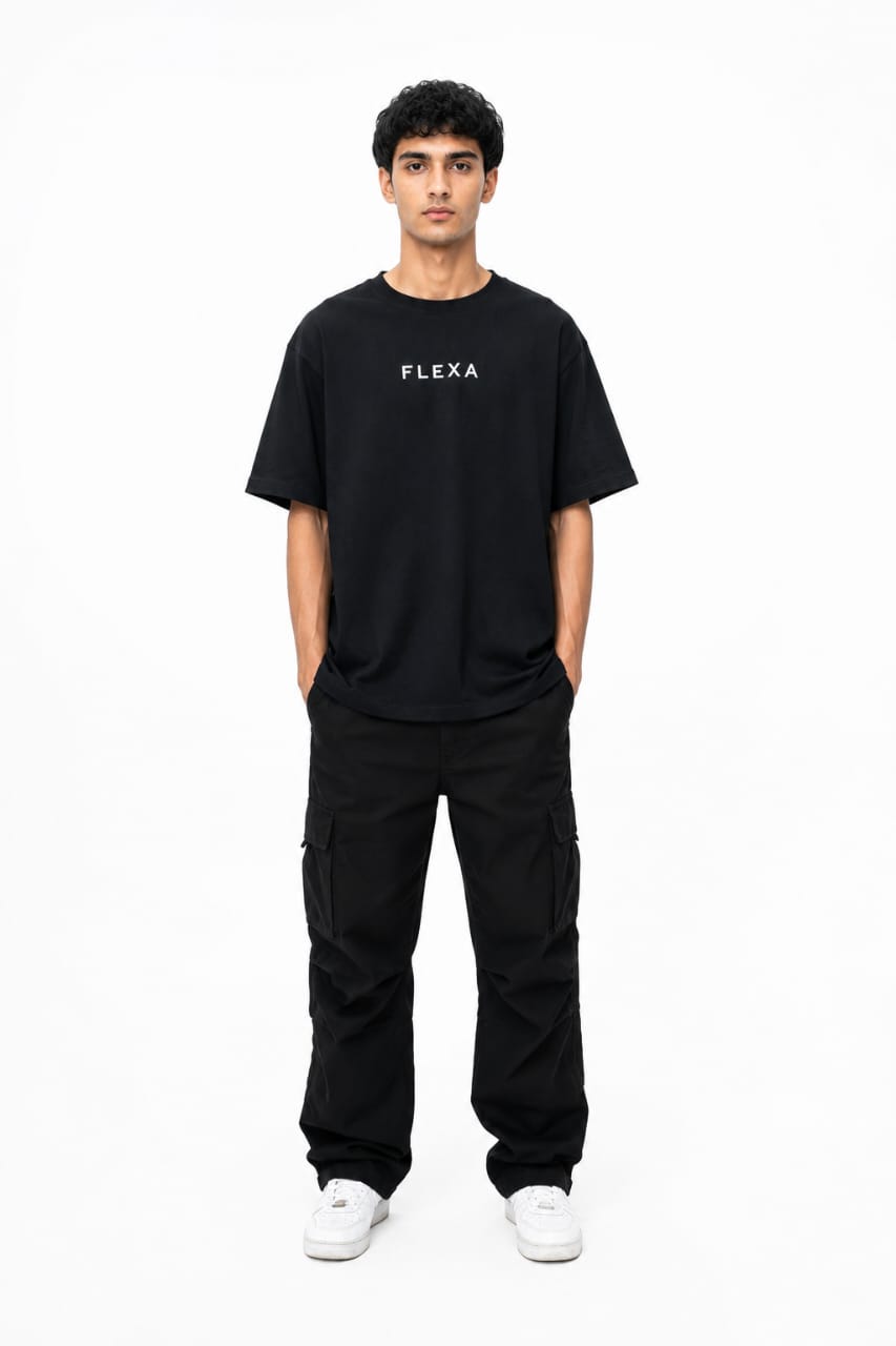 Person wearing a black 'FLEXA' t-shirt and pants on a white background