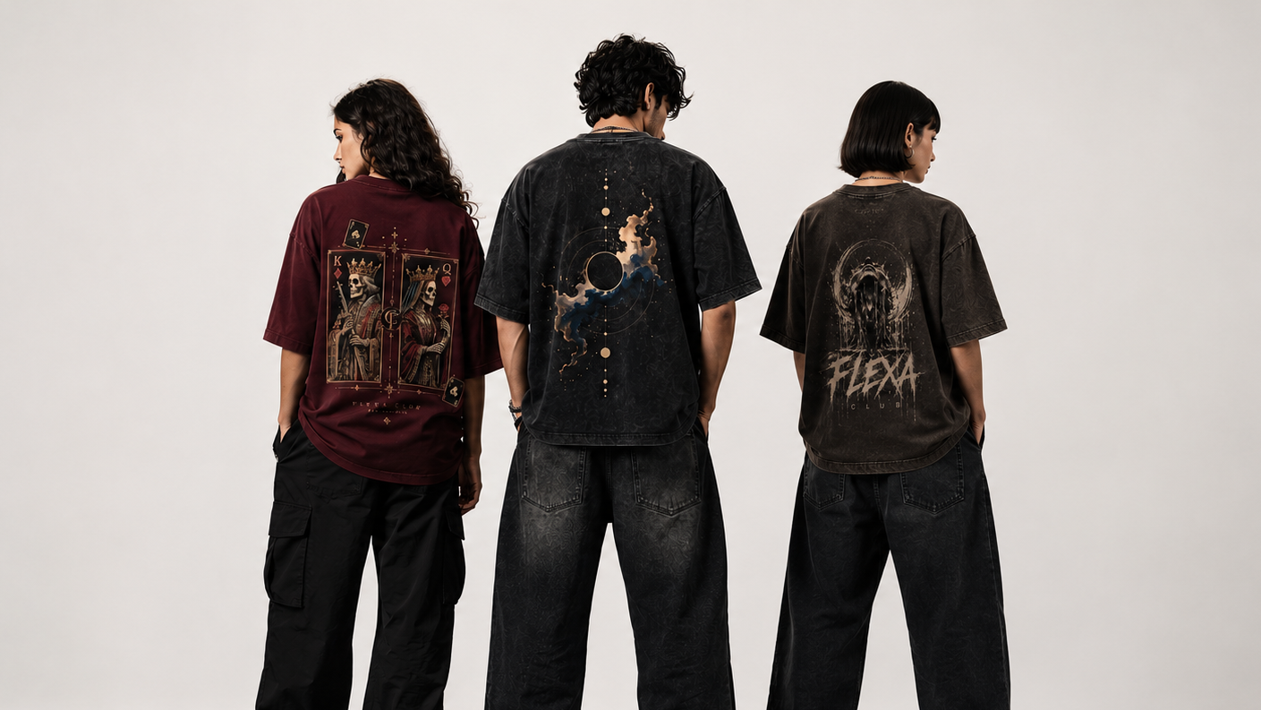 Three models standing with their backs to the camera wearing oversized black graphic t-shirts and black cargo pants against a plain white studio background.