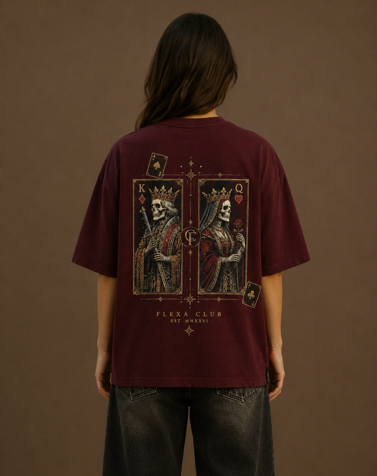 A person viewed from behind wearing an oversized burgundy T-shirt with a large back DTF graphic showing two illustrated card figures and the text 'FLEXA CLUB' and 'Established 2026' in Roman Numerals.