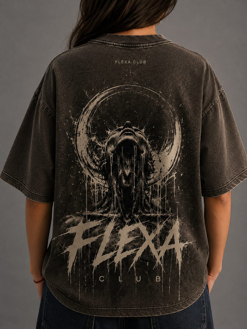 Person wearing a black t-shirt with 'Flexa Club' graphic design on the back against a gray background