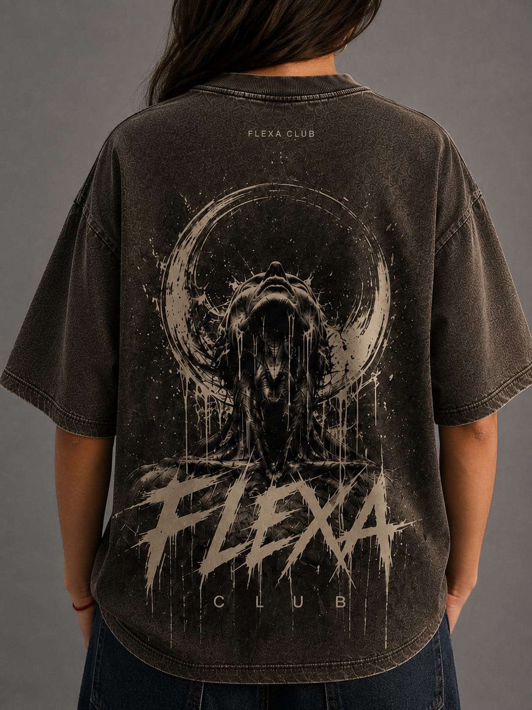 Person wearing a black t-shirt with 'Flexa Club' graphic design on the back against a gray background